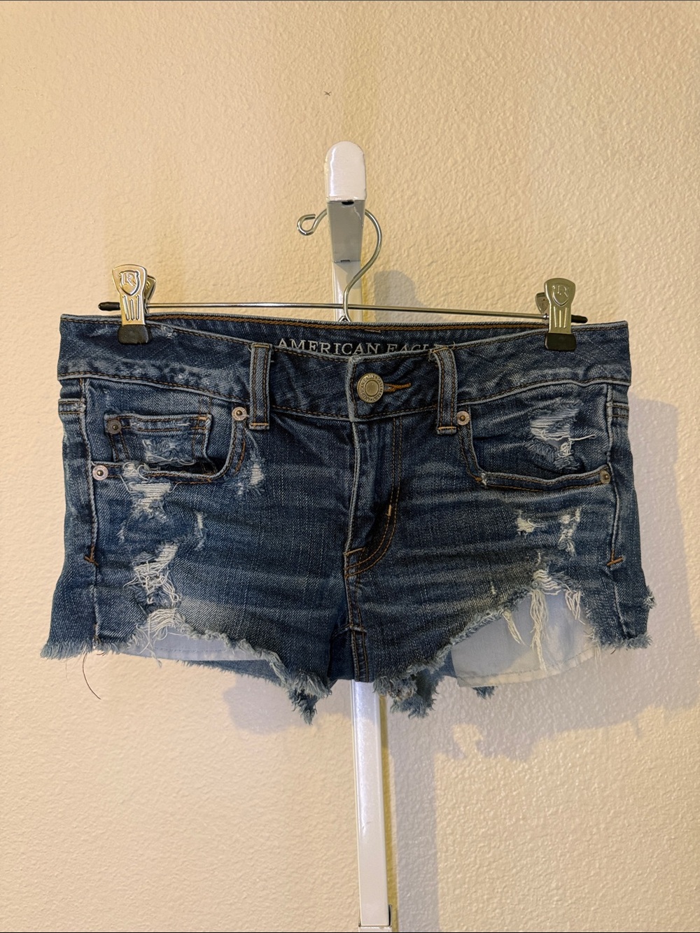 American Eagle Outfitters Low-Rise Dark Wash Distressed Jean Shortie Shorts